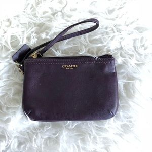 NWOT Plum Coach Wristlet with Gold Details